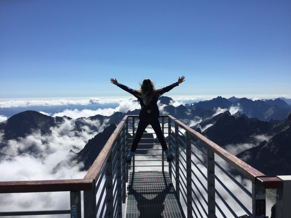 picture of a girl looking over mountains